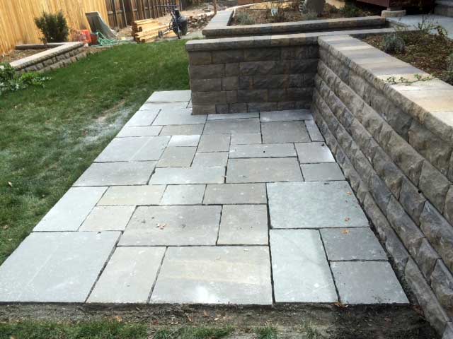 This India Stone patio in Boulder accents the stone planters.