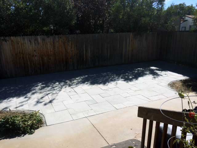 Pearl grey India Stone pavers were used to enhance this outdoor living space in Longmont, CO.