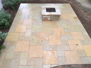 The gas fire pit, built from Stone Universe matches the patio built from the company's Paver Ashlar.
