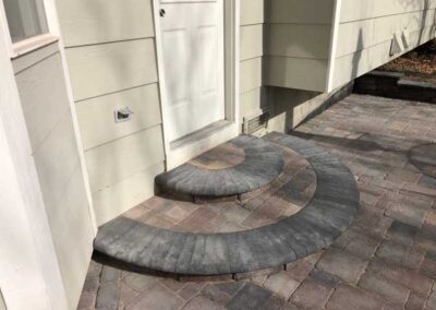 These circular steps are made with Bogert pavers and create a great accent for the back entryway.