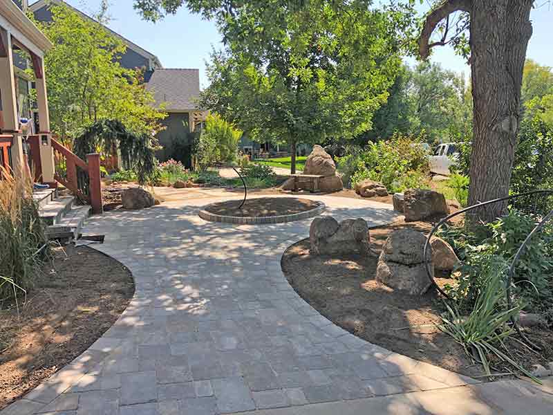 Unique patio uses Borgert Strasson pavers and small growing areas.