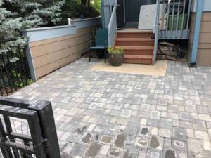 Grey pavers create an extensive outdoor living area for this Lafayette home.