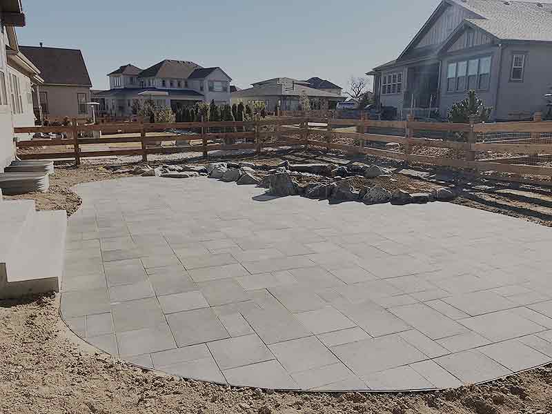 Stone paver patio and rock enclosed garden in Longmont