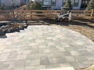 Precut stone pavers can create expansive outdoor living areas, while cutting construction costs compared to more extensive masonry.