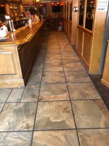 Porcelain pavers make an attractive flooring in the Erie, CO, bar.