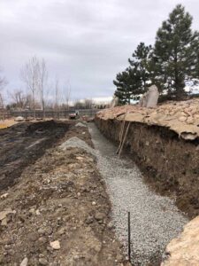 Excavation for a large retaining wall at Longmont property